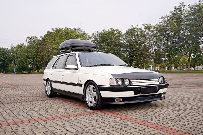 Representative photo of a glossy hard-shell rooftop cargo box on a vehicle